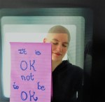 Picture of me with a purple post-it that reads: It is OK not to be OK
