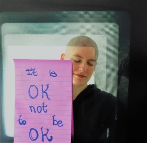 Picture of me with a purple post-it that reads: It is OK not to be OK