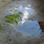 Heart-shaped puddle reflecting the sky